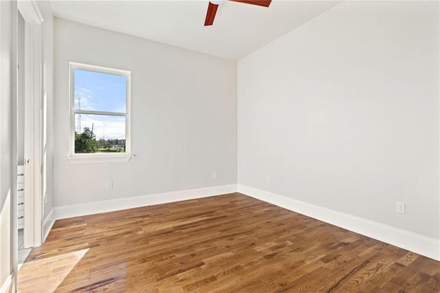 spare room featuring ceiling fan and hardwood / wood-style flooring