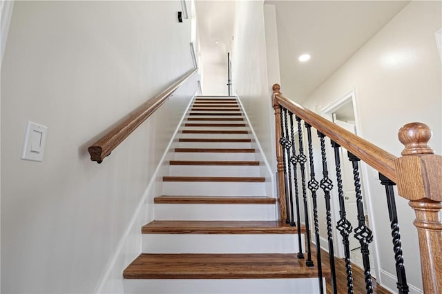 staircase featuring hardwood / wood-style floors