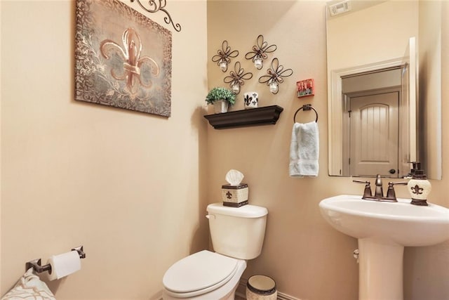 bathroom featuring sink and toilet