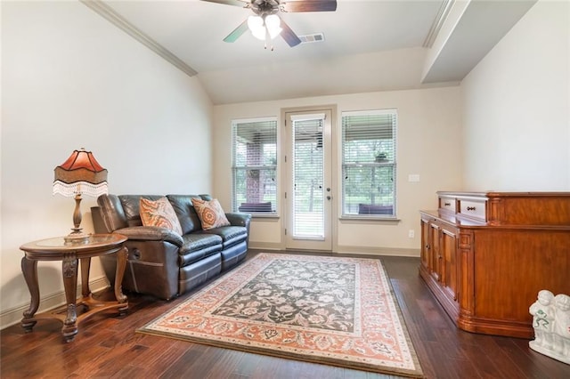 interior space featuring dark hardwood / wood-style floors, ceiling fan, lofted ceiling, and crown molding