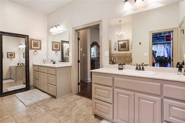 bathroom featuring vanity and a notable chandelier