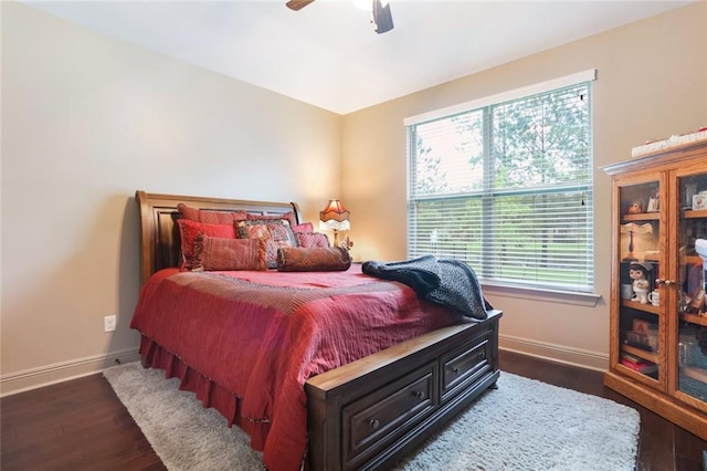 bedroom featuring dark hardwood / wood-style floors and ceiling fan