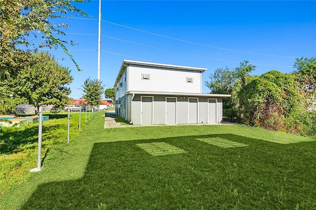 rear view of property featuring a yard