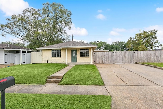 bungalow-style house with a front lawn