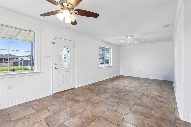 entrance foyer with ceiling fan and ornamental molding