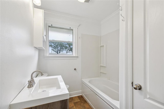 bathroom featuring vanity, bathtub / shower combination, and ornamental molding