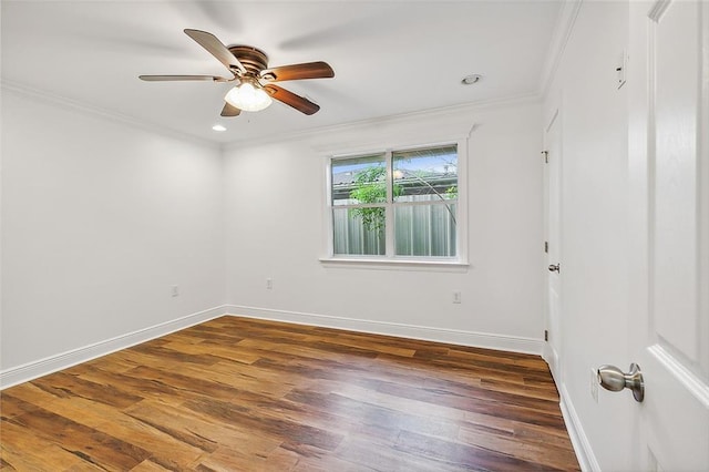 spare room with dark hardwood / wood-style floors, ceiling fan, and ornamental molding