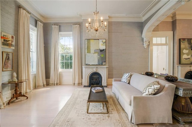 living room with a notable chandelier and ornamental molding