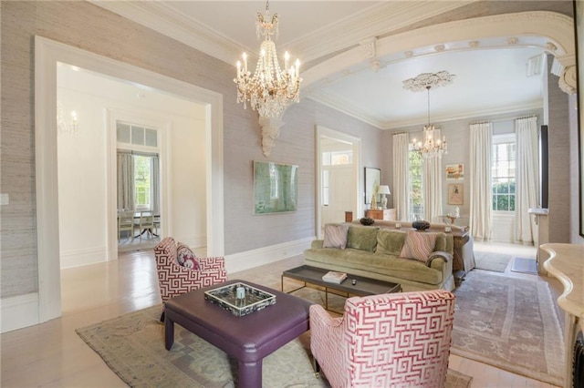 living room featuring crown molding, a wealth of natural light, and a notable chandelier