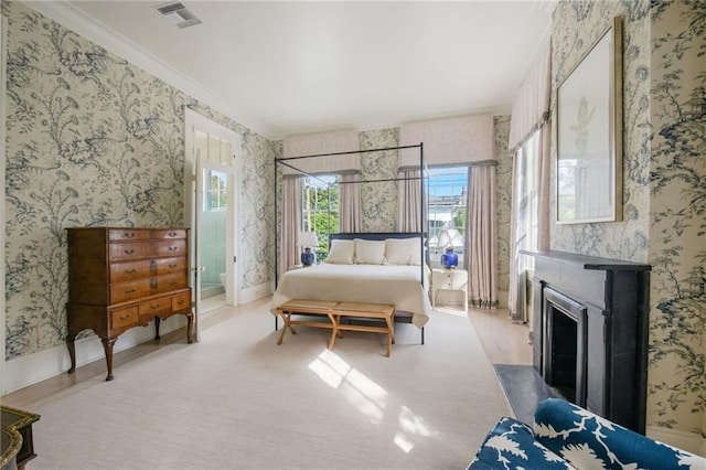 bedroom with light carpet and ornamental molding