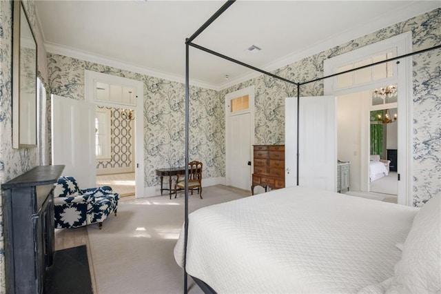 bedroom featuring light colored carpet, connected bathroom, crown molding, and a chandelier