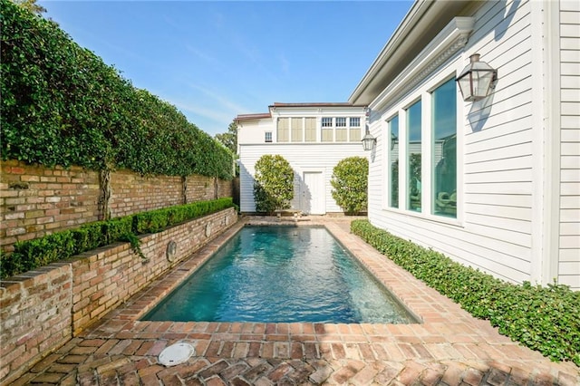 view of pool with a patio, a fenced backyard, and a fenced in pool