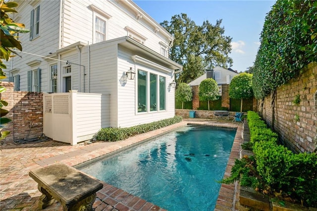 view of pool featuring a fenced backyard and a fenced in pool