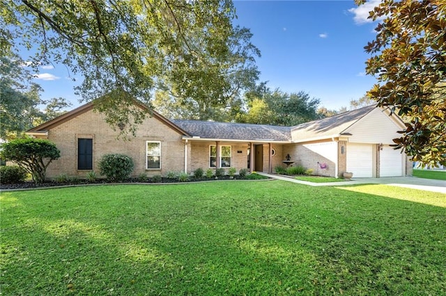 ranch-style house featuring a front yard and a garage