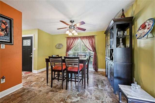 dining space featuring ceiling fan