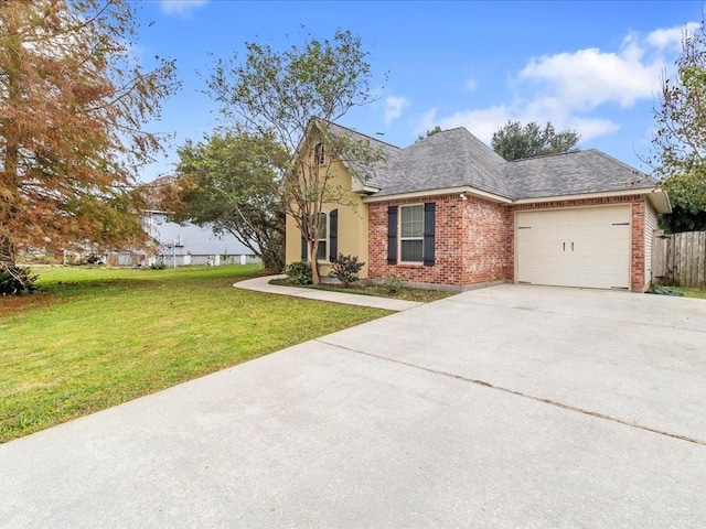 view of front of home featuring a garage and a front lawn