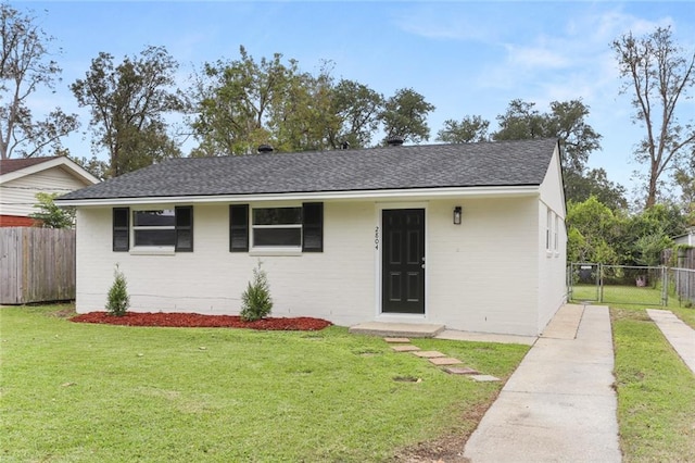 ranch-style house with a front lawn