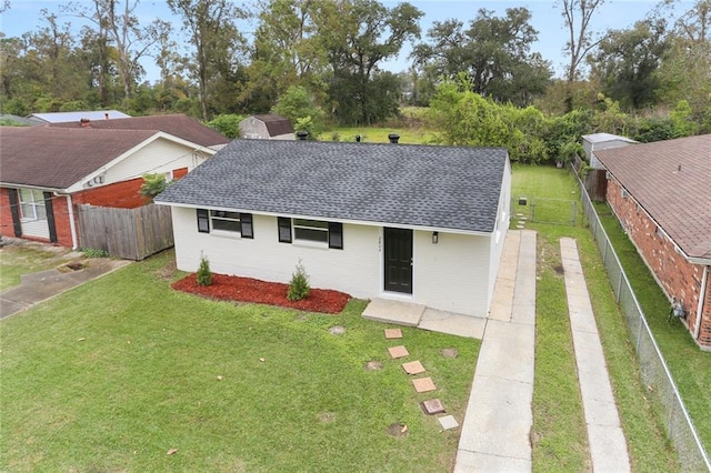 single story home with a front yard