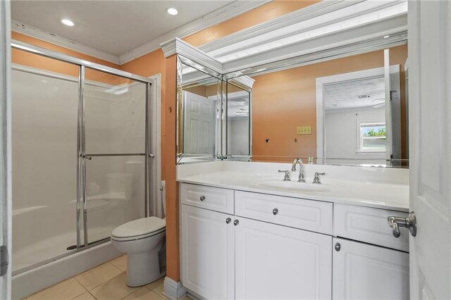 bathroom featuring tile patterned floors, toilet, vanity, and walk in shower