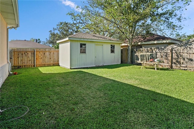 view of yard featuring a storage unit