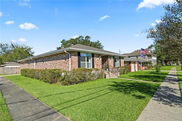 ranch-style home featuring a front yard