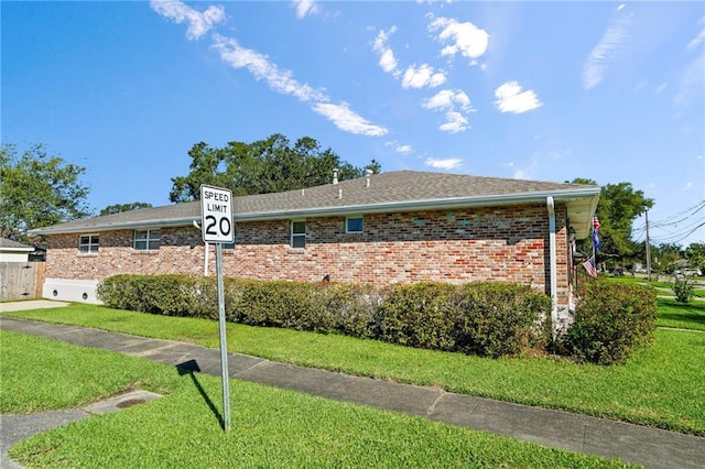 136 Rebel Ave, River Ridge, LA 70123 - view of property exterior with brick siding and a yard