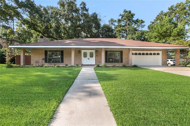 ranch-style home with a garage and a front lawn