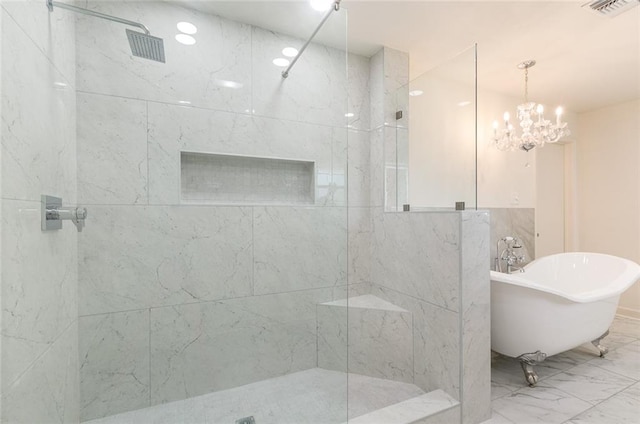 bathroom with separate shower and tub and a notable chandelier