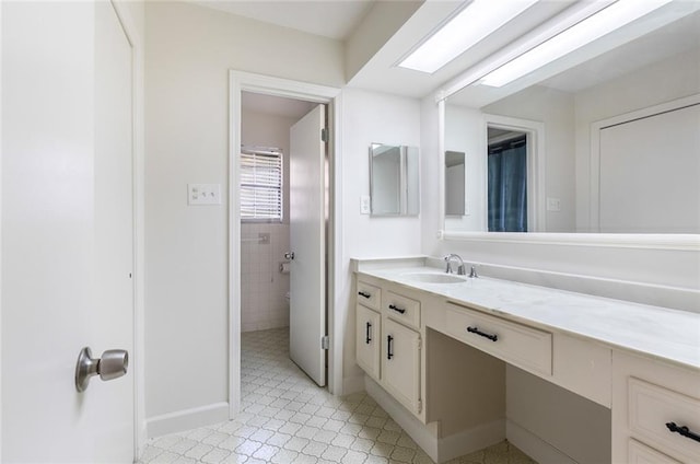 bathroom featuring tile patterned floors and vanity