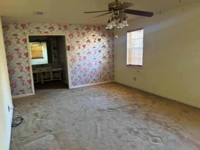 unfurnished bedroom with carpet flooring and ceiling fan