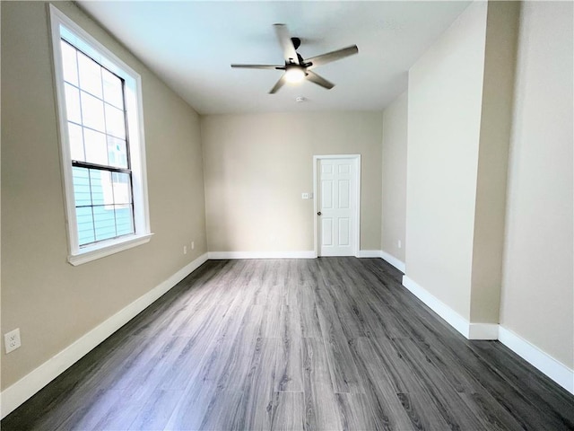 343335 Magnolia St, New Orleans, LA 70115 - empty room with dark wood-style floors and a ceiling fan