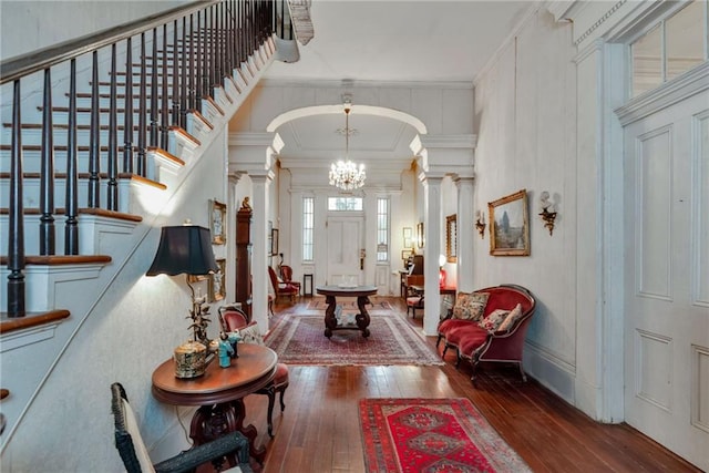 2513 Red Lick Rd, Lorman, MS 39096 - entryway featuring ornate columns, wood-type flooring, stairs, ornamental molding, and arched walkways