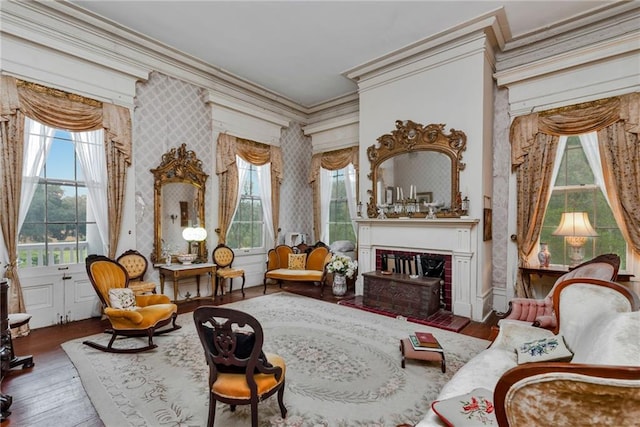 2513 Red Lick Rd, Lorman, MS 39096 - sitting room featuring crown molding, a fireplace, hardwood / wood-style floors, plenty of natural light, and wallpapered walls