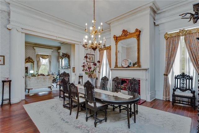 2513 Red Lick Rd, Lorman, MS 39096 - dining room with a chandelier, wood-type flooring, crown molding, wallpapered walls, and a fireplace