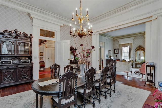 2513 Red Lick Rd, Lorman, MS 39096 - dining area featuring wallpapered walls, a chandelier, ornamental molding, and hardwood / wood-style flooring