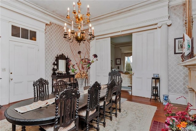 2513 Red Lick Rd, Lorman, MS 39096 - dining area with wallpapered walls, a chandelier, wood finished floors, and ornamental molding