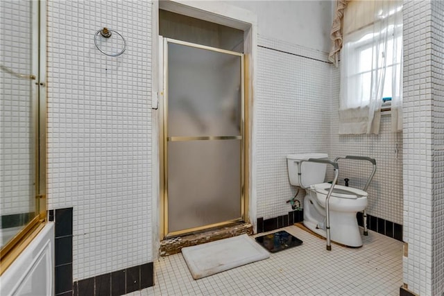 2513 Red Lick Rd, Lorman, MS 39096 - bathroom featuring a stall shower, tile walls, and tile patterned floors