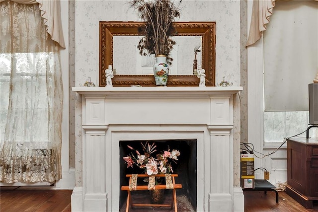 2513 Red Lick Rd, Lorman, MS 39096 - detailed view of wallpapered walls, wood finished floors, and a fireplace