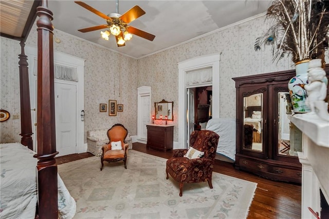 2513 Red Lick Rd, Lorman, MS 39096 - bedroom featuring wood-type flooring, wallpapered walls, ornamental molding, and a ceiling fan