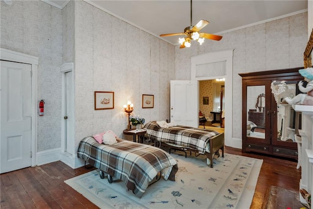 2513 Red Lick Rd, Lorman, MS 39096 - bedroom featuring hardwood / wood-style flooring, ornamental molding, a ceiling fan, and wallpapered walls