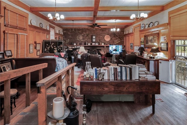 2513 Red Lick Rd, Lorman, MS 39096 - misc room with a chandelier, wood finished floors, a ceiling fan, beamed ceiling, and brick wall