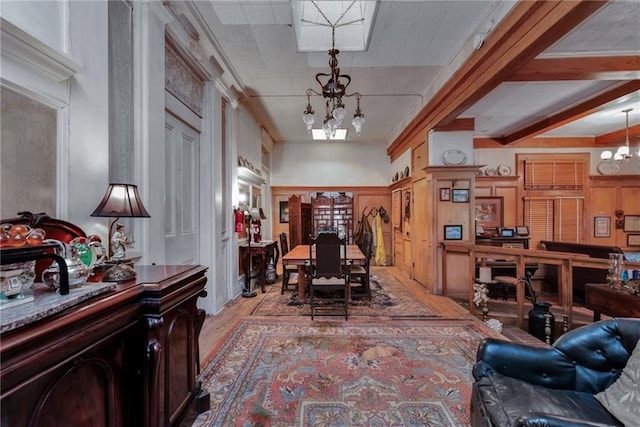 2513 Red Lick Rd, Lorman, MS 39096 - living room with a chandelier, light wood finished floors, and a decorative wall