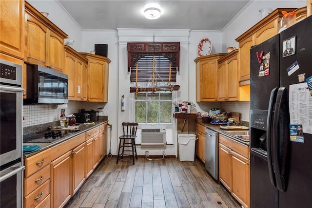 2513 Red Lick Rd, Lorman, MS 39096 - kitchen featuring black appliances, ornamental molding, dark countertops, wood finished floors, and backsplash