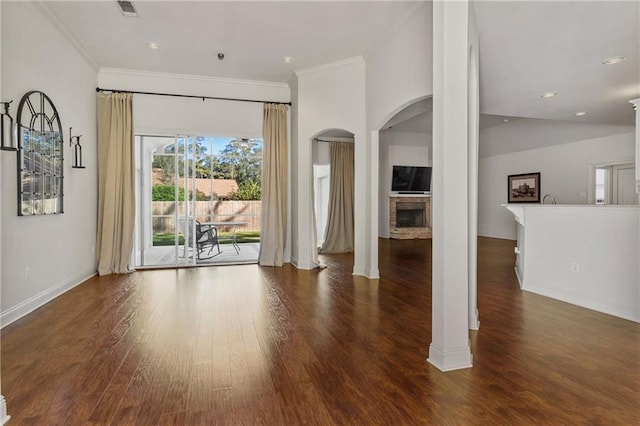 unfurnished living room with a fireplace, dark hardwood / wood-style flooring, and ornamental molding