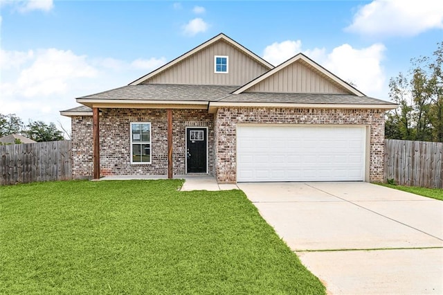 view of front facade with a garage and a front lawn