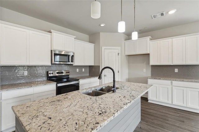 kitchen with white cabinetry, sink, an island with sink, and stainless steel appliances