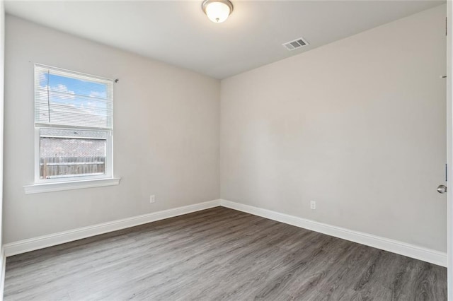 empty room featuring wood-type flooring