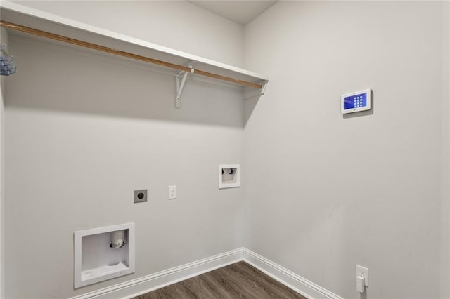 washroom with hookup for an electric dryer, dark wood-type flooring, and hookup for a washing machine