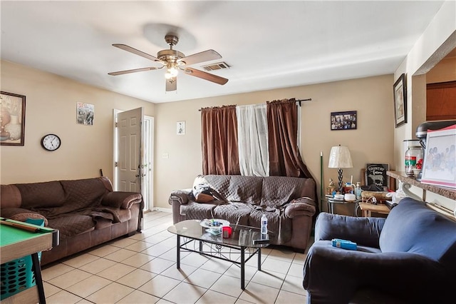 tiled living room with ceiling fan