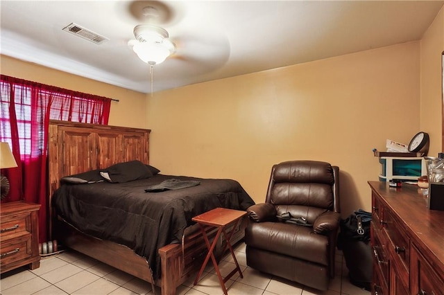 tiled bedroom with ceiling fan